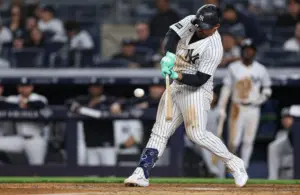 May 4, 2026; Bronx, New York, USA; New York Yankees left fielder Jasson Dominguez (24) hits an RBI single during the eighth inning against the Baltimore Orioles at Yankee Stadium.