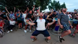 Trent Jameson cheers after a goal with other soccer fans during a watch party at Skinny Slim's in Oklahoma City for the FIFA World Cup game between the United State's men's team and, Friday, June 12, 2026.