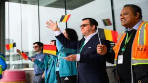 Jun 8, 2026; Seattle, Washington, USA; FIFA and airport employees wave flags as the Belgium men's national team departs the airport for the 2026 FIFA World Cup in Seattle, WA.