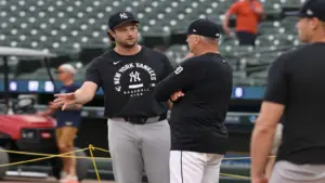 Jun 24, 2026; Detroit, Michigan, USA; New York Yankees pitcher Gerrit Cole, left, talks with Detroit Tigers manager A.J. Hinch before their game at Comerica Park.