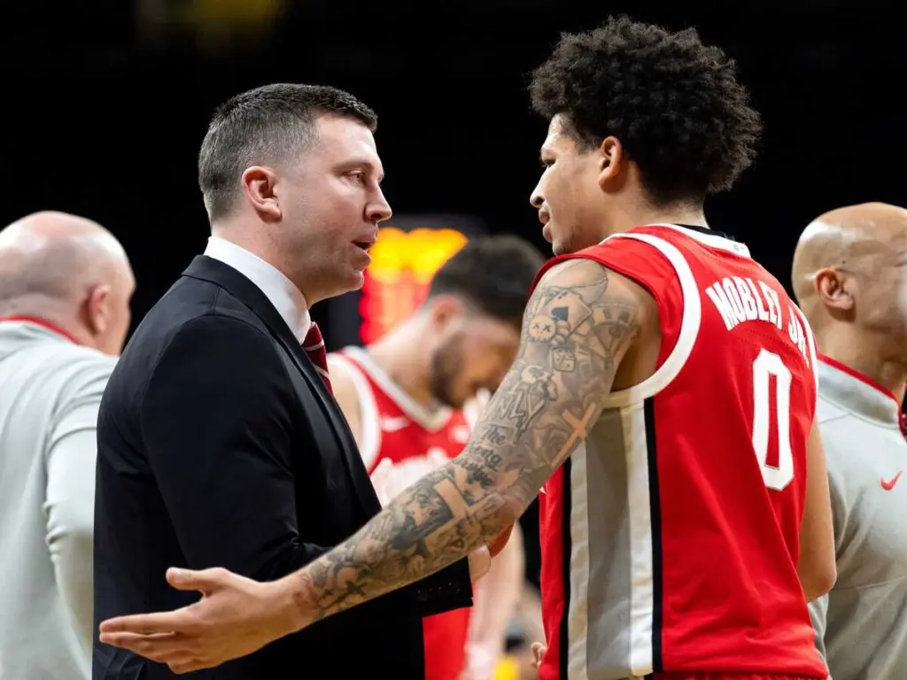 Ohio State head coach Jake Diebler talks to Ohio State guard John Mobley Jr. (0) during a timeout while playing against the Iowa Hawkeyes Feb. 25, 2026 at Carver-Hawkeye Arena in Iowa City, Iowa. Mobley will now be joined by LJ Smith.