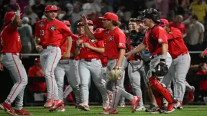 Jun 16, 2026; Omaha, NE, USA; The Georgia Bulldogs team celebrates the win against the Texas Longhorns at Charles Schwab Field.