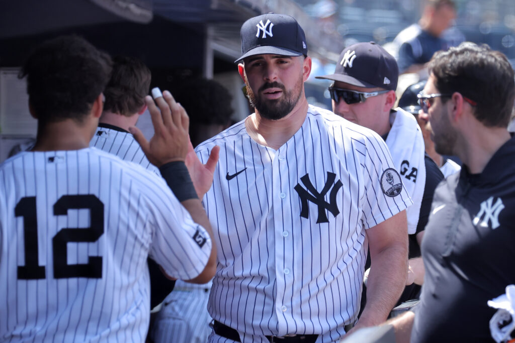 Jun 4, 2026; Bronx, New York, USA; New York Yankees starting pitcher Carlos Rodon (55) high fives teammates in the dugout after the top of the sixth inning against the Cleveland Guardians at Yankee Stadium.
