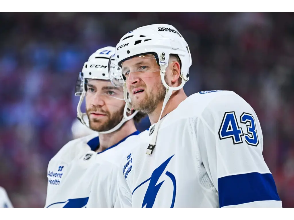 Apr 26, 2026; Montreal, Quebec, CAN; Tampa Bay Lightning defenseman Darren Raddysh (43) looks on beside center Brayden Point (21) during warm-up before the game against the Montreal Canadiens in game four of the first round of the 2026 Stanley Cup Playoffs at Bell Centre. Mandatory Credit: David Kirouac-Imagn Images