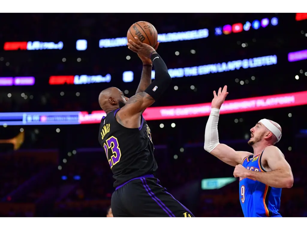 May 11, 2026; Los Angeles, California, USA; Los Angeles Lakers forward LeBron James (23) shoots against Oklahoma City Thunder guard Alex Caruso (9) during the first half in game four of the second round of the 2026 NBA Playoffs at Crypto.com Arena. Mandatory Credit: Gary A. Vasquez-Imagn Image