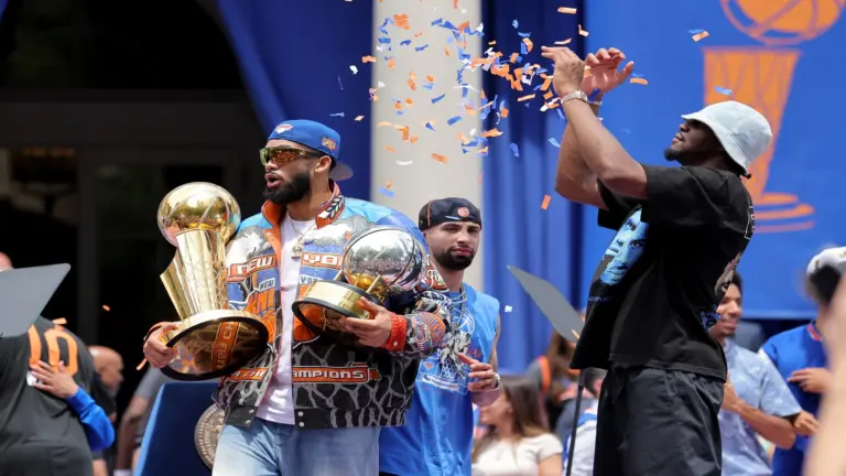 Jun 18, 2026; New York, NY, USA; New York Knicks center Ariel Hukporti (right) tosses confetti onto center Karl-Anthony Towns after a ceremony at New York City Hall after their championship parade.