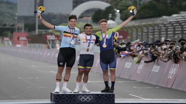Jul 24, 2021; Shizuoka, Japan; From left, Wout van Aert (BEL), Richard Carapaz (ECU) and Tadej Pogacar (SLO) on the podium after the Men's Road Race during the Tokyo 2020 Olympic Summer Games at Fuji Speedway. Carapaz won gold, van Aert won silver, and Pogacar won bronze.