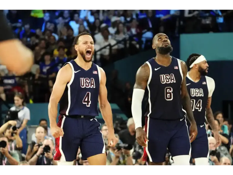 Stephen Curry (4) and guard LeBron James (6) of Team USA react in the second half against France in the men's basketball gold medal game during the Paris 2024 Olympic Summer Games at Accor Arena in Paris, France, on August 10, 2024