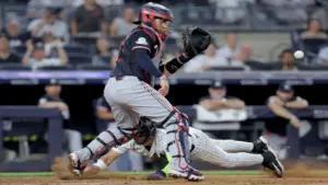 Jul 3, 2026; Bronx, New York, USA; New York Yankees shortstop Jose Caballero (72) scores a run against Minnesota Twins catcher Victor Caratini (37) on a sacrifice fly by Yankees center fielder Trent Grisham (not pictured) during the seventh inning at Yankee Stadium.
