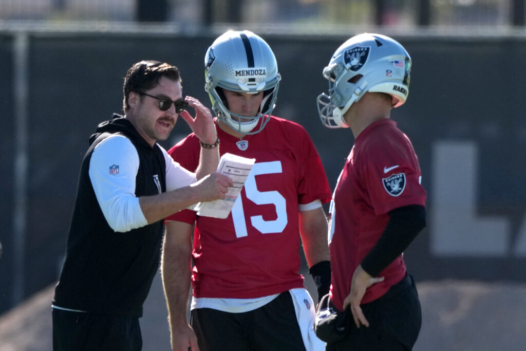 Jun 9, 2026; Henderson, NV, USA; Las Vegas Raiders offensive coordinator Andrew Janocko (left) talks with quarterbacks Fernando Mendoza (15) and Kirk Cousins (8) during minicamp at Intermountain Health Performance Center. Mandatory Credit: Kirby Lee-Imagn Images