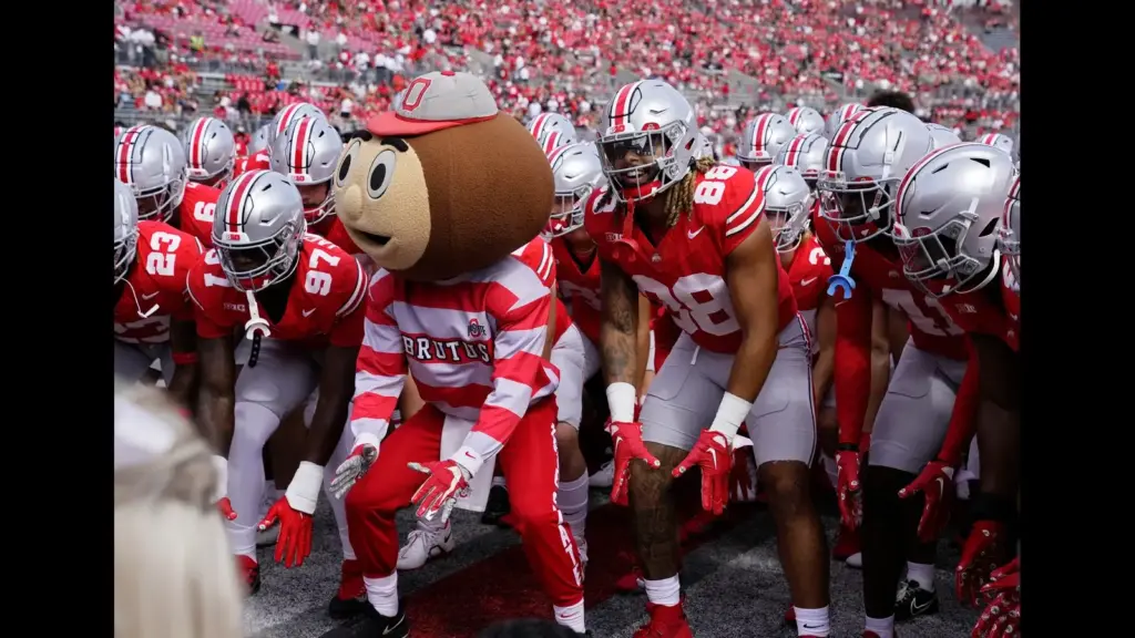 Sept. 9, 2023; Columbus, Oh., USA; Brutus Buckeye and Ohio State Buckeyes tight end Gee Scott Jr. (88) take a stance as the Ohio State Buckeyes huddle up before Saturday's NCAA Division I football game against the Youngstown State Penguins at Ohio Stadium. Credit USA TODAY Network via Reuters Connect.