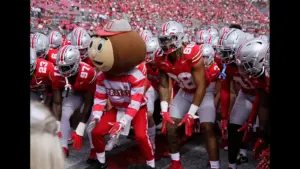 Sept. 9, 2023; Columbus, Oh., USA; Brutus Buckeye and Ohio State Buckeyes tight end Gee Scott Jr. (88) take a stance as the Ohio State Buckeyes huddle up before Saturday's NCAA Division I football game against the Youngstown State Penguins at Ohio Stadium.
