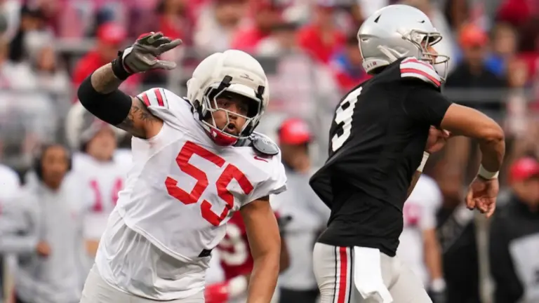 Ohio State defensive tackle John Walker menacing Julian Sayin.