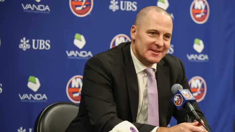 Nov 22, 2025; Elmont, New York, USA; New York Islanders General Manager Mathieu Darche speaks with fans at a pre-game event prior to the game against the St. Louis Blues at UBS Arena. Mandatory Credit: Wendell Cruz-Imagin Images | IMAGN IMAGES via Reuters Connect