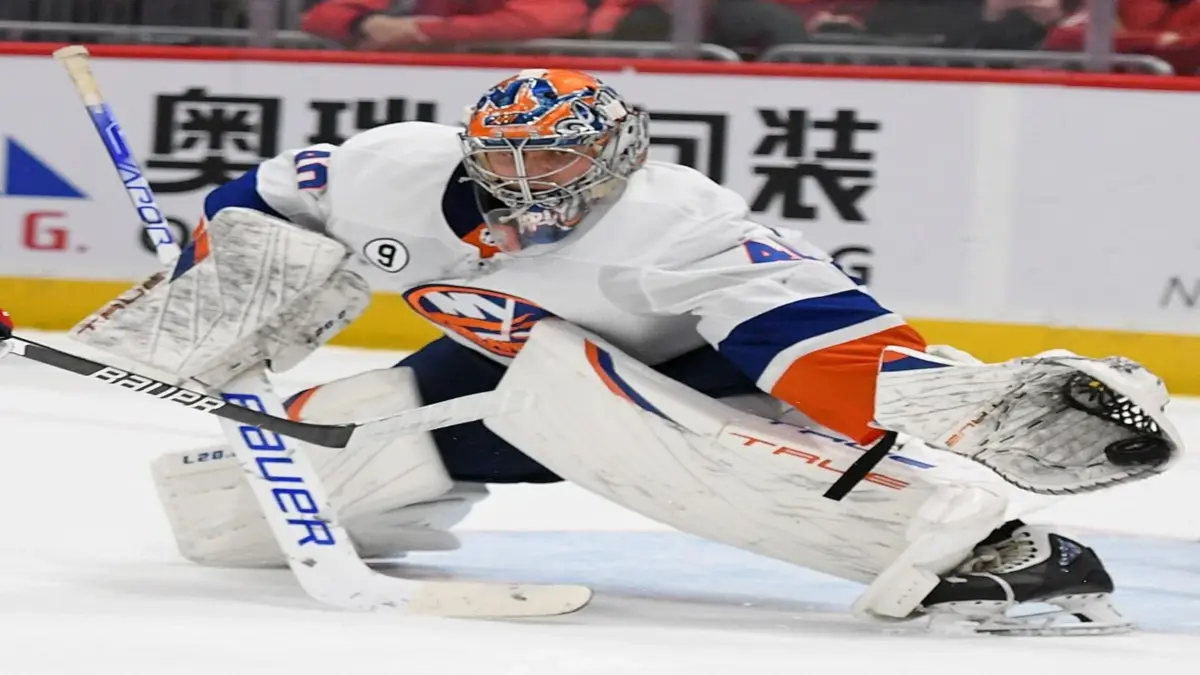 Semyon Varlamov makes save on Evgeny Kuznetsov during a game at Capital One Arena on March 15, 2022.