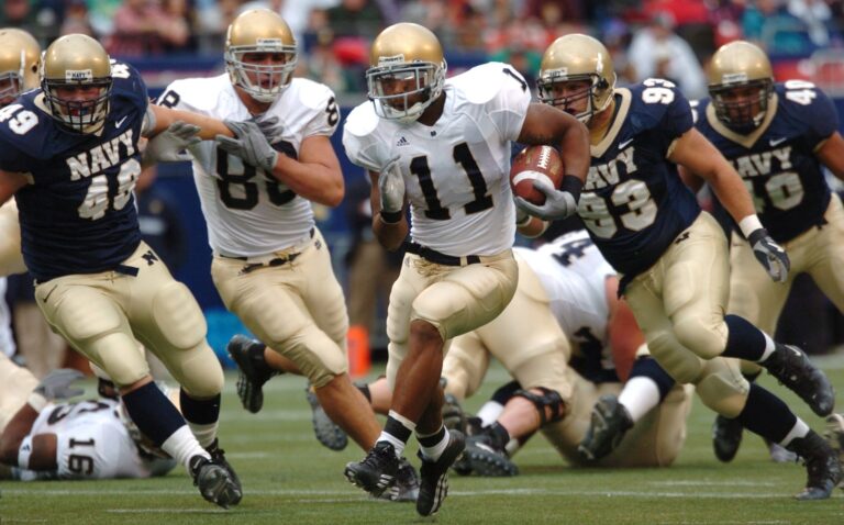 College Football Playoff race: ball carrier runs against Navy defenders