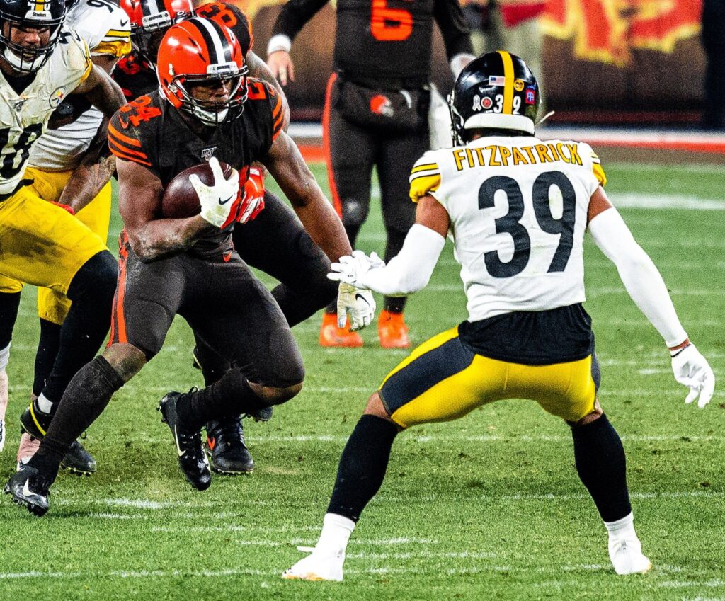 Minkah Fitzpatrick, then with the Steelers, and Browns running back Nick Chubb during a 2019 game; the Minkah Fitzpatrick injury has sidelined him with the Jets